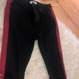 Black jeans with red stripes down the side